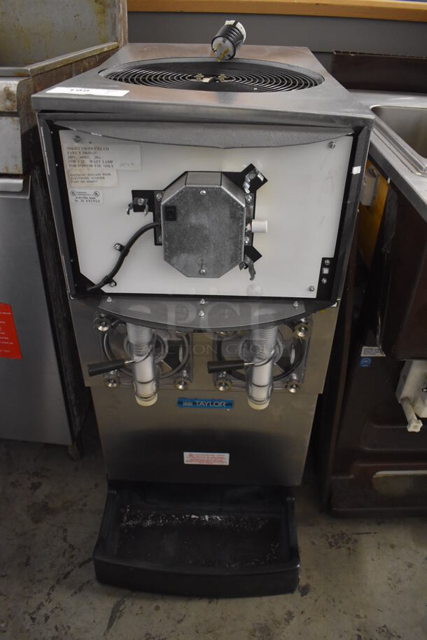 Taylor Stainless Steel Commercial 2 Flavor Frozen Beverage Machine. 208/240 Volts, 1 Phase. 17x31x36