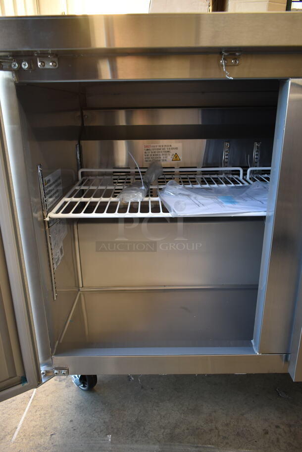 BRAND NEW SCRATCH AND DENT! 2023 KoolMore FWT-2D-12C Stainless Steel Commercial 2 Door Work Top Freezer w/ Back Splash on Commercial Casters. 115 Volts, 1 Phase. Tested and Working! - Image 6 of 8