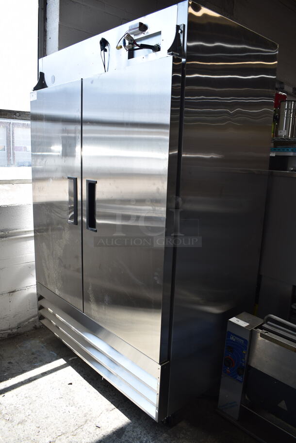 BRAND NEW SCRATCH AND DENT! 2024 Avantco 178A49FHC Stainless Steel Commercial 2 Door Reach In Freezer w/ Poly Coated Racks on Commercial Casters. 115 Volts, 1 Phase. Cannot Test - Interior Pieces are Detached - Image 3 of 9