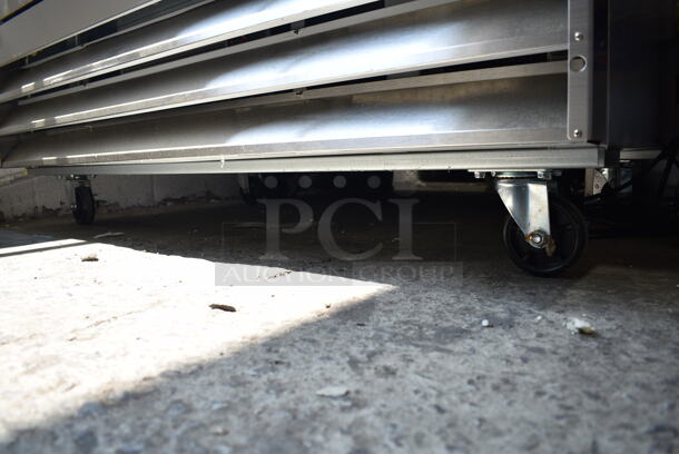 BRAND NEW SCRATCH AND DENT! 2024 Avantco 178A49FHC Stainless Steel Commercial 2 Door Reach In Freezer w/ Poly Coated Racks on Commercial Casters. 115 Volts, 1 Phase. Cannot Test - Interior Pieces are Detached - Image 5 of 9
