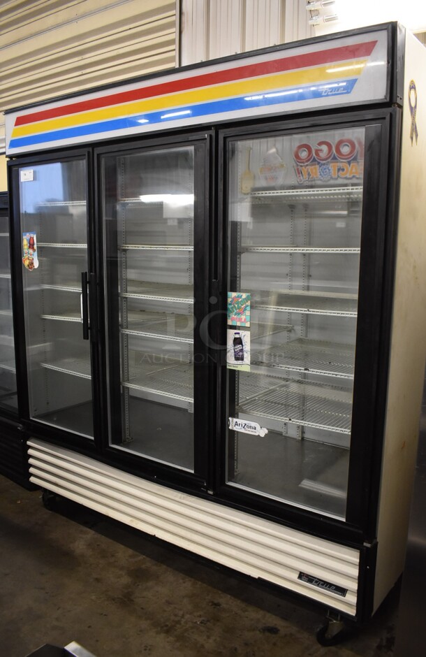 True GDM-72 Metal Commercial 3 Door Reach In Cooler Merchandiser w/ Poly Coated Racks on Commercial Casters. 115 Volts, 1 Phase. 78x31x84. Tested and Powers On But Temps at 47 Degrees