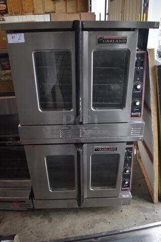 2 Garland Master 200 Stainless Steel Commercial Natural Gas Powered Full Size Convection Oven w/ View Through Doors, Metal Oven Racks and Thermostatic Controls on Commercial Casters. 38x38x70. 2 Times Your Bid!