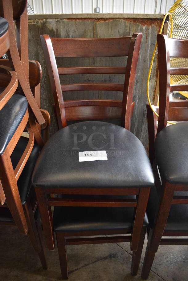 4 Wooden Dining Chairs w/ Black Seat Cushion. 17x18x34. 4 Times Your Bid!
