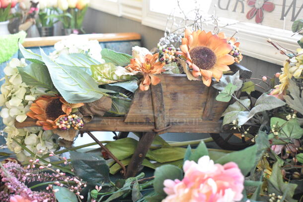 Wall Mount Table w/ Contents Including Spring/Summer Floral Decor. BUYER MUST REMOVE: Bring Tools and Manpower Needed To Remove This Item. (booth room)  - Image 9 of 9