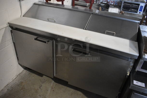 Beverage Air Stainless Steel Commercial Sandwich Salad Prep Table Bain Marie Mega Top w/ Various Drop In Bins and Cutting Board on Commercial Casters. 115 Volts, 1 Phase. 60x27.5x41. Tested and Powers On But Temps at 51 Degrees