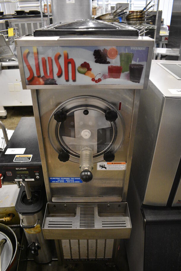 Electro Freeze Model 876-234 Stainless Steel Commercial Floor Style Air Cooled Frozen Beverage Slushie Machine on Commercial Casters. 115 Volts, 1 Phase. 15x30x59