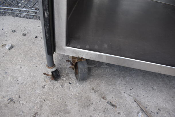 Stainless Steel Commercial Table w/ 2 Under Shelves and 2 Over Shelves on Commercial Casters. 36x24x55 - Image 5 of 5