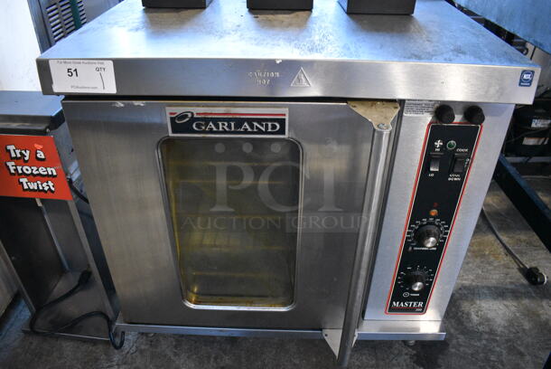 Garland Model MCO-E-5-C Master 200 Stainless Steel Commercial Electric Powered Half Size Convection Oven w/ View Through Door, Metal Oven Racks and Thermostatic Controls. 208 Volts, 3 Phase. 30.5x26x30