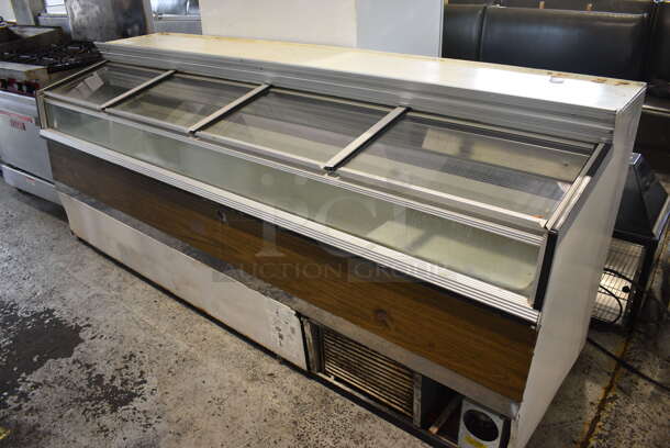 Metal Commercial Chest Freezer Merchandiser w/ 4 Sliding Lids. 96x32x39.5. Tested and Powers On But Does Not Get Cold