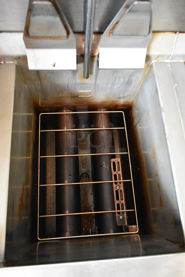 2016 Henny Penny OGA-323 ENERGY STAR Stainless Steel Commercial Natural Gas Powered 3 Bay Fryer w/ 4 Metal Fry Baskets on Commercial Casters. 255,000 BTU.  - Image 7 of 12