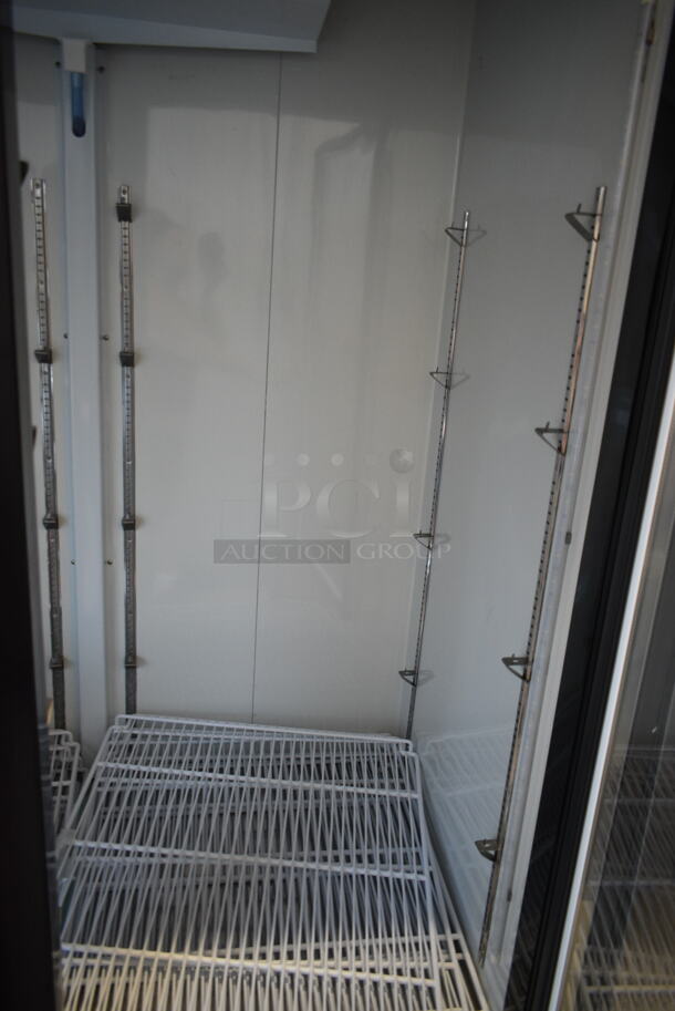 BRAND NEW SCRATCH AND DENT! 2024 Avantco 178GDC49HCB 53" Black Customizable Swing Glass Door Merchandiser Refrigerator with LED Lighting and Poly Coated Racks. 115 Volts, 1 Phase. Tested and Powers On But Does Not Get Cold - Image 4 of 10