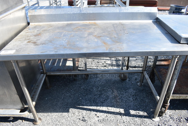 Stainless Steel Table w/ Back Splash on Commercial Casters. 55x30x40