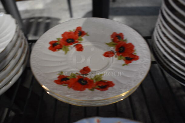 4 White Ceramic Saucers w/ Red Floral Pattern. 6.5x6.5x1. 4 Times Your Bid! - Image 1 of 3
