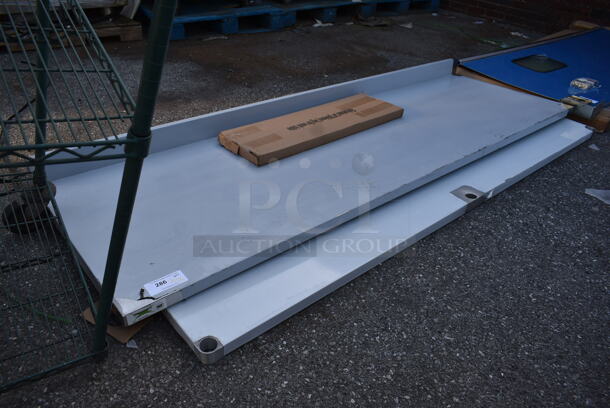 BRAND NEW SCRATCH AND DENT! Regency 600TB3096G 30" x 96" 18-Gauge 304 Stainless Steel Commercial Work Table with 4" Backsplash and Galvanized Undershelf - Image 4 of 6