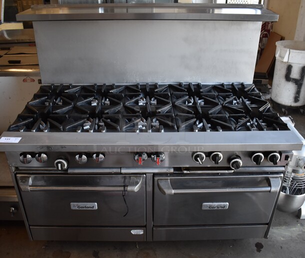 LATE MODEL! Garland Stainless Steel Commercial Natural Gas Powered 10 Burner Range w/ CONVECTION Oven, Oven, Over Shelf and Back Splash on Commercial Casters. 59x35x57 - Image 1 of 6