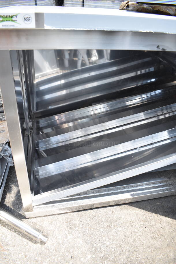 BRAND NEW SCRATCH AND DENT! Regency 600EBT3048D 30" x 48" 16 Gauge Type 304 Stainless Steel Enclosed Base Table with Sliding Doors and Adjustable Midshelf - Image 6 of 7