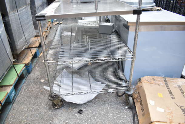 Stainless Steel Table w/ Wire Over Shelf and 2 Wire Under Shelves on Commercial Casters. Does Not Come w/ Contents. BUYER MUST DISMANTLE. PCI CANNOT DISMANTLE FOR SHIPPING. PLEASE CONSIDER FREIGHT CHARGES. - Image 2 of 4