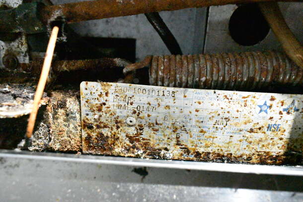 Garland M44R Stainless Steel Commercial Floor Style Natural Gas Powered 4 Burner Range w/ Oven, Over Shelf and Back Splash on Commercial Casters.  - Image 7 of 7