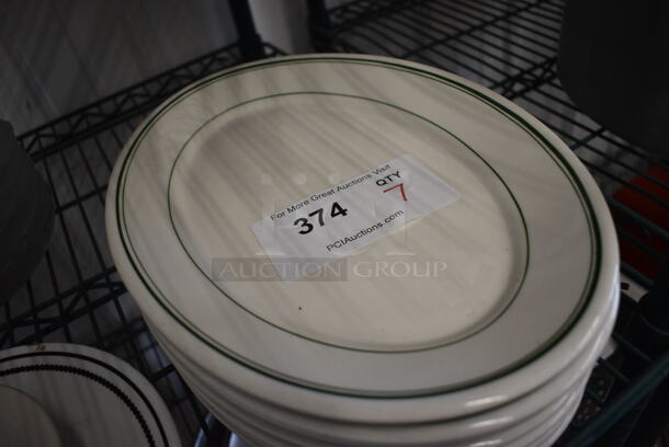 7 White Ceramic Oval Plates w/ Green Lines on Rim. 12.5x9x1. 7 Times Your Bid! - Image 3 of 3