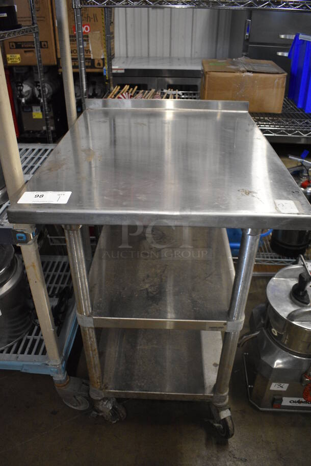 Stainless Steel Table w/ Back Splash and 2 Under Shelves on Commercial Casters. 24x30x37  - Image 1 of 4