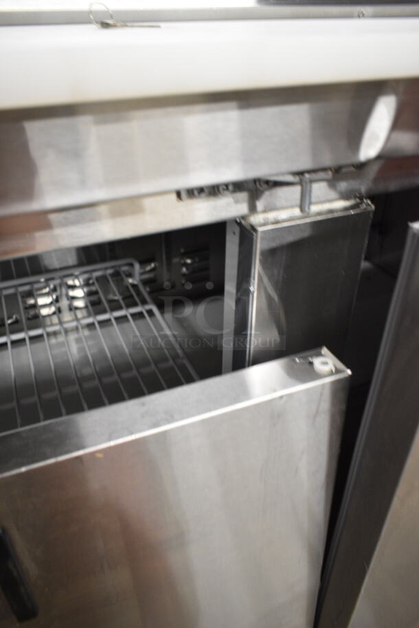 BRAND NEW SCRATCH AND DENT! 2024 Avantco 178APT71HC Stainless Steel Commercial 70" 3 Door Refrigerated Sandwich Prep Table on Commercial Casters. 115 Volts, 1 Phase. Tested and Working!  - Image 9 of 12