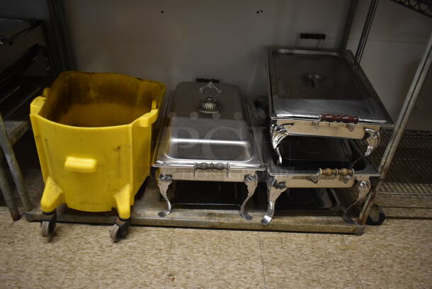 Chrome Finish 3 Tier Wire Shelving Unit w/ Contents Including Chafing Dishes and Mop Bucket. BUYER MUST REMOVE: BUYER MUST DISMANTLE. PCI CANNOT DISMANTLE FOR SHIPPING. PLEASE CONSIDER FREIGHT CHARGES. (hallway) - Image 2 of 4