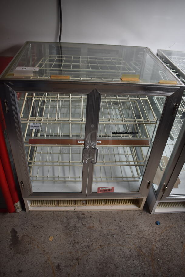 Dry Bakery Case With Double Glass Door and Polycoated Racks.