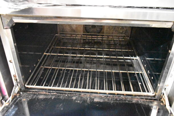 Vulcan Stainless Steel Commercial Natural Gas Powered 6 Burner Range w/ Convection Oven, Over Shelf and Back Splash on Commercial Casters.  - Image 4 of 6