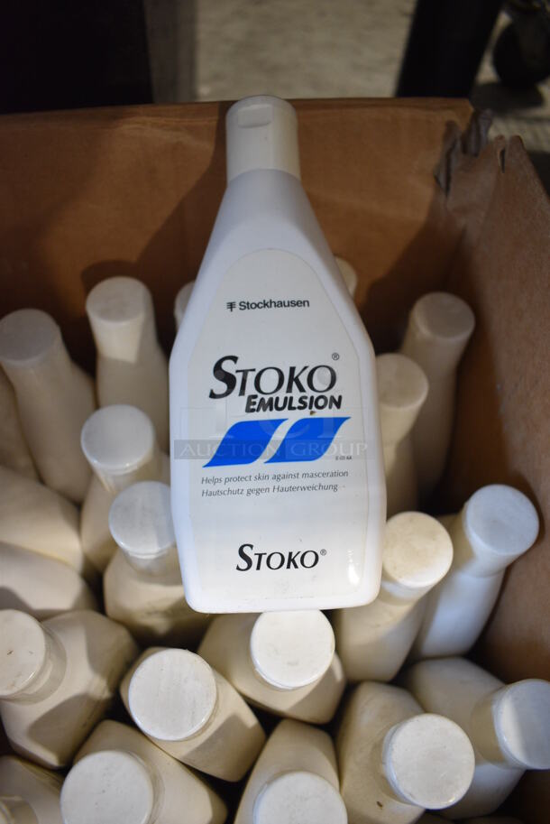 Box of 34 Stoko Emulsion Skin Protectant Bottles. 4.5x3.5x8.5
