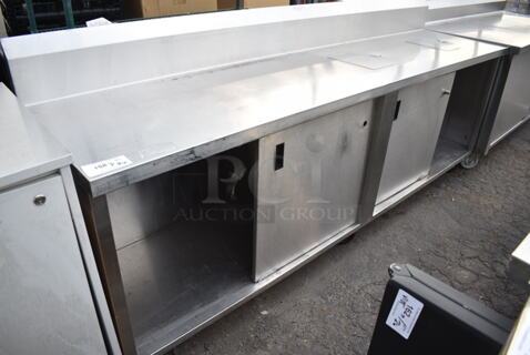 WinHolt Stainless Steel Counter w/ Back Splash, Under Shelf and Doors on Commercial Casters. 