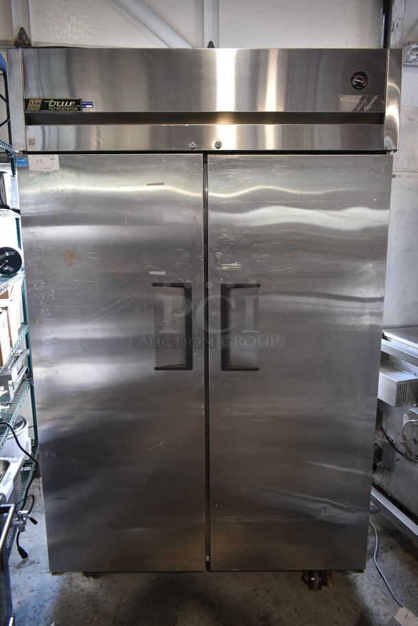 2012 True TG2R-2S ENERGY STAR Stainless Steel Commercial 2 Door Reach In Cooler w/ Poly Coated Racks on Commercial Casters. 115 Volts, 1 Phase. Tested and Working! - Image 1 of 9