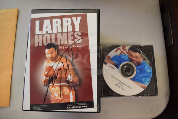 ALL ONE MONEY! Lot of 7 Larry Holmes Fight CDs and 9 Larry Holmes DVDs; One Autographed.