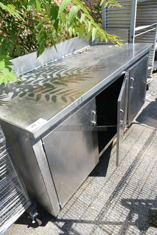 Stainless Steel Counter w/ 3 Doors and Back Splash. 