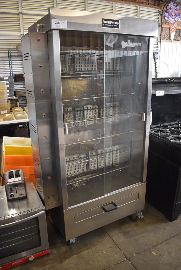 Southwood Model RG7-NAT Stainless Steel Commercial Floor Style Natural Gas Powered 7 Spit Rotisserie Oven on Commercial Casters. 48x22x76