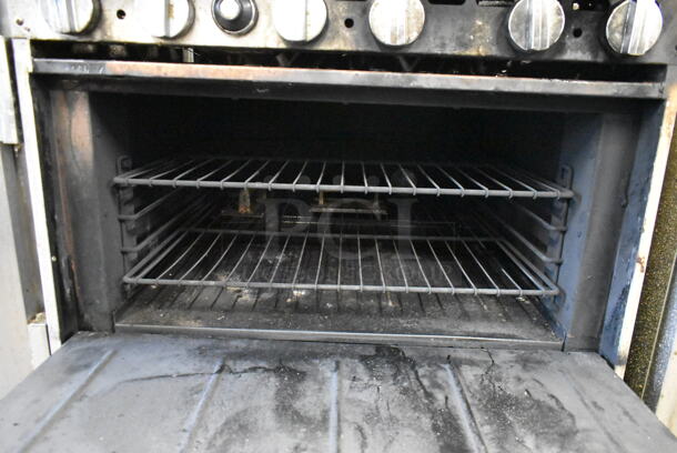 Bakers Pride Stainless Steel Commercial Natural Gas Powered 6 Burner Range w/ Oven and Back Splash on Commercial Casters. - Image 5 of 7