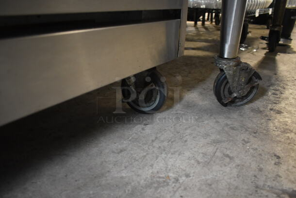 Vulcan Stainless Steel Commercial Natural Gas Powered 6 Burner Range w/ Oven, Over Shelf and Back Splash on Commercial Casters.  - Image 5 of 6