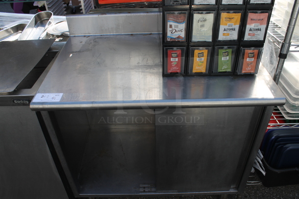 Stainless Steel Commercial Table w/ Back Splash and Under Shelf.