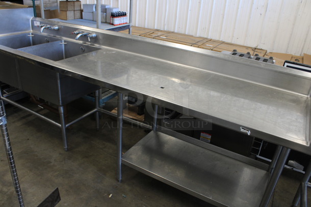 Stainless Steel Commercial Counter w/ Double Sink Bay, Faucets, Handles, Left Side Splash Guard, Back Splash and Partial Under Shelf. 120x30x46