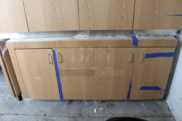 BRAND NEW! Commercial 4 Door Cabinet In Wood Style Finish With White Shelves. - Image 1 of 4