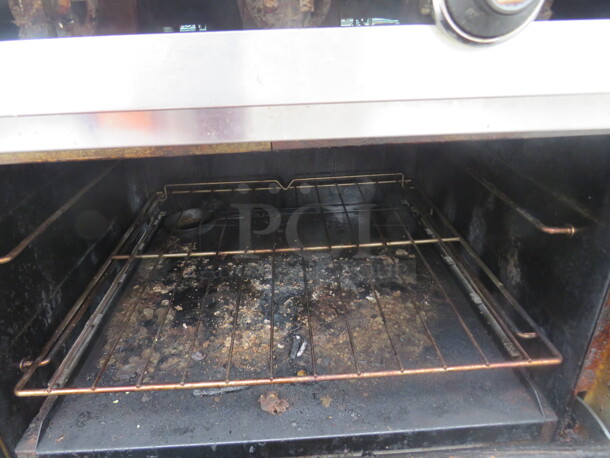 One Continental Natural Gas 6 Burner/24 Inch Griddle Range With SS Over Shelf, 2 Racks, And Salamander On Casters. 61X35X74 - Image 3 of 3