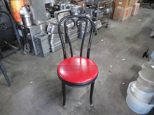 Black Metal Chair With A Red Cushioned Seat. 2XBID