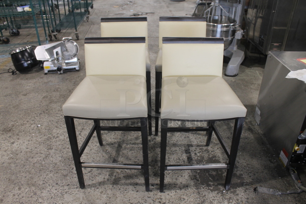 4 Bar Height Vinyl Cream Colored Cushioned Chairs With Brown Legs. Cosmetic Condition May Vary. 4 Times Your Bid!