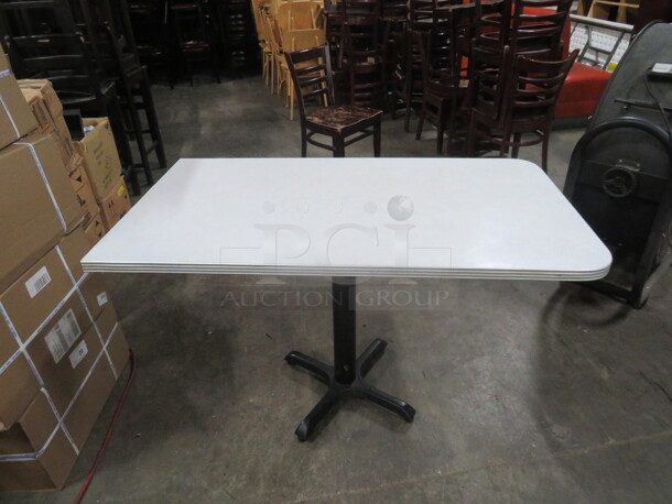 One Laminate Table Top  On A Pedestal Base. 48X27X30 - Image 1 of 3