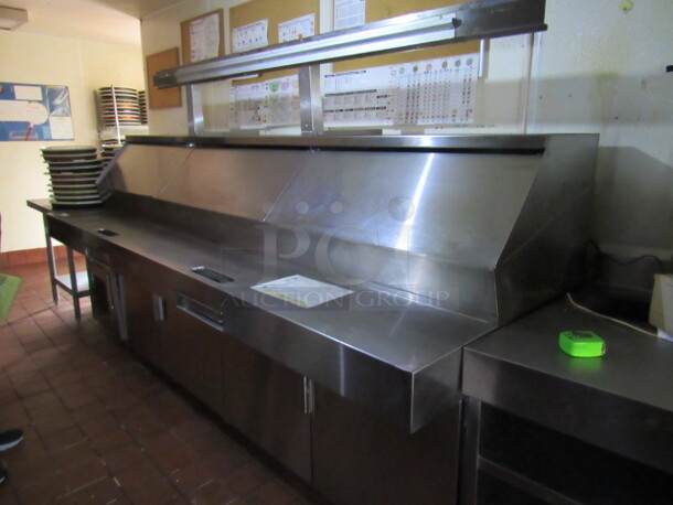 BUYER MUST REMOVE! One Stainless Steel Randell 4 Door Pizza Prep Table With SS Over Shelf With 72 Inch Rail With 3 Racks On Casters. 115 Volt. Model# PH120E2.1 120X42X69