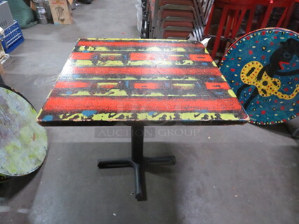 One 30X30X30 Abstract Painted  Table Top On A Pedestal Base. Chipped Corner See Pic.