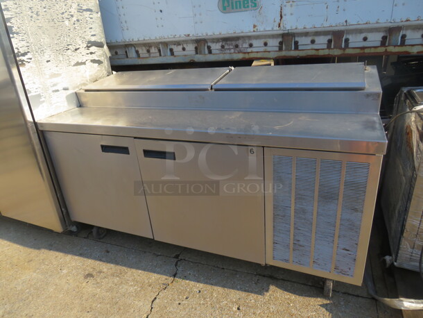 One Delfield 2  Door Stainless Steel Prep Table With 2 Racks,  On Casters. 115 Volt. Working Not Cold. 77X32X83.  - Image 1 of 1