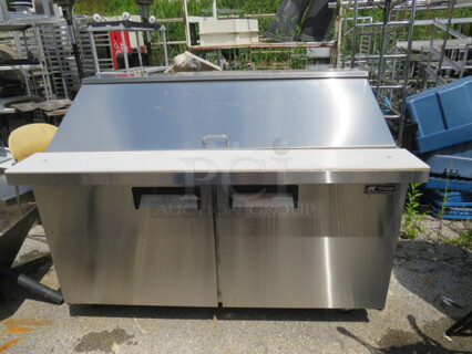 One Stainless Steel 2 Door Polar Refrigerated Prep Table With 2 Racks And Cutting Board,  On Casters. Model# SCLM2-60-E. 115 Volt. 60X34X45.5