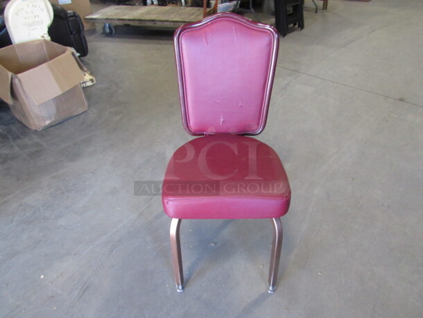 Metal Chair With Red Cushioned Seat And Back. 4XBID.