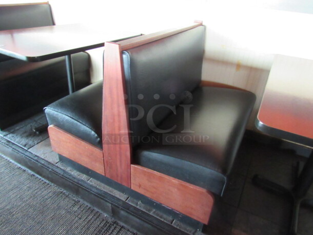 One Double Sided Wooden Booth With A Black Cushioned Seat And Back. 43X48X36