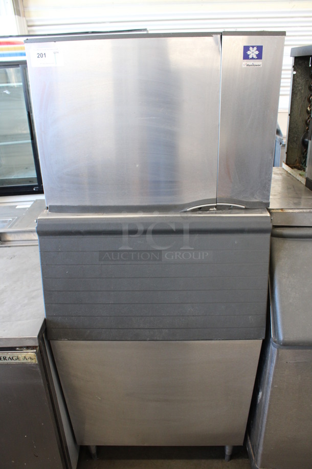 Manitowoc Model SY0504A Stainless Steel Commercial Ice Machine on Commercial Ice Bin. 115 Volts, 1 Phase. 31x29x72